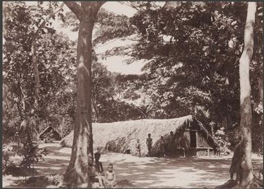 Group of children standing in front of gamal in Ara, Banks Islands, 1906 / J.W. Beattie