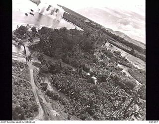 HANSA BAY, NEW GUINEA. 1943-08-28. FIFTH OF A SERIES OF FIVE GRAPHIC PHOTOGRAPHS TAKEN FROM A RAAF PLANE DURING THE BOMBING OF JAPANESE SUPPLY CRAFT, ILLUSTRATING THE CONSEQUENCES OF FOLLOWING A ..