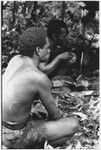 Men eating the ritual pudding