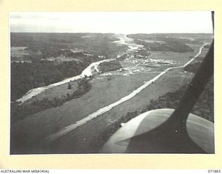 LAE, NEW GUINEA. 1944-03-30. AN AERIAL VIEW AT LAE OF THE BUSU RIVER THE 2/8TH AND 2/7TH AUSTRALIAN GENERAL HOSPITALS
