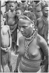 Government-sponsored festival in Tabibuga: adolescent girl with tattooed face, snail shell earrings, trade beads, white powder on face and hair