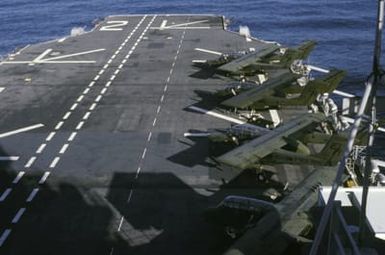 Four US Marines Corps OV-10 Bronco aircraft are parked on the flight deck of the amphibious assault ship USS SAIPAN (LHA 2)