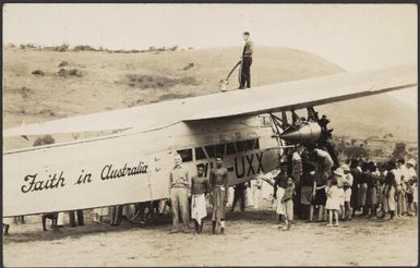 Onlookers surrounding "Faith in Australia" plane VH-UXX as it is refuelled, Port Moresby, Papua New Guinea, 26 July 1934