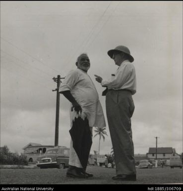 Officer speaking with Indian man