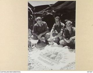 WEWAK POINT, NEW GUINEA. 1945-10-02. A SMARTNESS OF LINES COMPETITION WAS HELD AT 2/3 MACHINE-GUN BATTALION AND TROOPS WERE GIVEN A WEEK TO DECORATE THEIR LINES. THE COMPETITION WAS WON BY THIS 10 ..