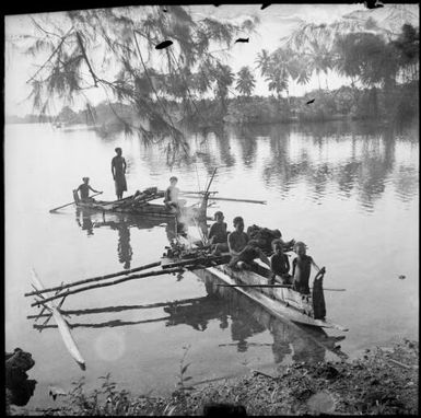 Two laden outrigger canoes approaching the shore, Ramu River, New Guinea, 1935 / Sarah Chinnery