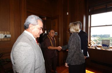 Secretary Gale Norton greeting members of visiting political delegation from American Samoa, including Governor Togiola Tulafono, left foreground, at Department of Interior headquarters