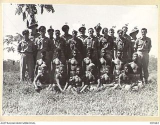 LAE, NEW GUINEA. 1945-10-05. MEMBERS OF THE ALLIED INTELLIGENCE BUREAU, NEW GUINEA, HEADQUARTERS. (FOR IDENTIFICATION OF 17 NAMED PERSONNEL REFER TO PROVISIONAL CAPTION OR NAME INDEX.)