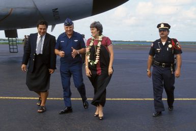 Major General (MGEN) Donald D. Brown, commander, 22nd Air Force, gives Samoan Lieutenant Governor Eni Hunkin and his wife a tour of a 22nd Military Airlift Command C-5 Galaxy aircraft. The aircraft delivered an emergency electrical generator and equipment to the island the day before