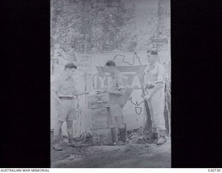 PAPUA. 1942-09. A YMCA TENT JUST BACK OF THE FRONT LINE IN THE OWEN STANLEY RANGE. YMCA AND SALVATION ARMY PERSONNEL MOVE FORWARD WITH THE TROOPS AND PROVIDE A PLACE WHERE THE SOLDIERS CAN WRITE ..