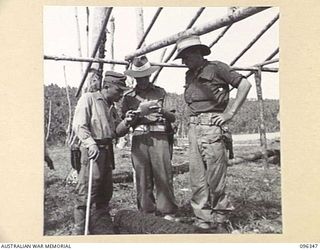 MUSCHU ISLAND, NEW GUINEA, 1945-09-08. CONFERENCE PRIOR TO SIGNING OF THE RECEIPT FOR TOOLS AND EQUIPMENT, BY THE JAPANESE OFFICER IN CHARGE. JAPANESE SOLDIERS ON THE ISLAND, UNDER THE CONTROL OF ..