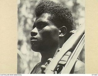 SONG RIVER AREA, NEW GUINEA. 1944-03-31. KORO, A MANUS ISLAND NATIVE SOLDIER OF C COMPANY, PAPUAN INFANTRY BATTALION