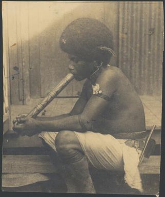 Tom from Goodenough Island smoking, Port Moresby, Papua, 1921 / Sarah Chinnery