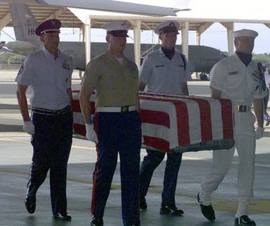 Joint Service Honor Guard members are carrying remains of US Service members, returned from Vietnam, to be identified at the Central Identification Lab of Hawaii on Hickam Air Force Base. The reparation ceremony was held on August 29th 2000