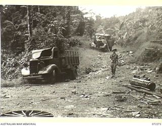 YAULA, NEW GUINEA. 1944-04-09. TWO OF THE MANY CHEVROLET TRUCKS CAPTURED FROM THE JAPANESE BY THE 57/60TH INFANTRY BATTALION ON THE ROAD TO BOGADJIM