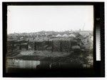 [Mill yard, drying lumber, and Houses in the background]