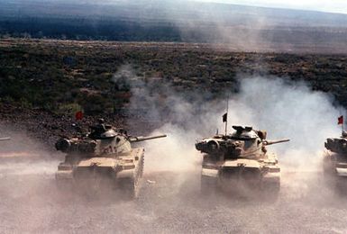 A live-fire exercise takes place with three M-60A1 tanks from A Troop, 3rd Squadron, 4th Cavalry, 25th Infantry Division, during annual training at the Pohakuloa Training Area