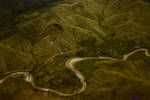 Aerial view of road and river in New Guinea highlands, Mar 1965