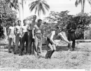 MADANG, NEW GUINEA. 1944-06-17. TROOPS PARTICIPATING IN THE BROAD JUMP AT A TABLOID SPORTS MEETING CONDUCTED BY HEADQUARTERS 15TH INFANTRY BRIGADE WITHIN THE SIAR PLANTATION. LEFT TO RIGHT: ..