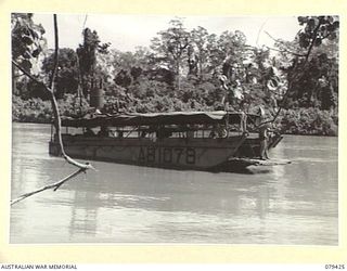 MEVELO RIVER, HENRY REID BAY, NEW BRITAIN. 5 MARCH 1945. THE HOSPITAL BARGE OF THE 1ST WATER TRANSPORT CONVOY READY FOR EVACUATION. OWING TO HEAVY JAPANESE MORTAR FIRE THE BARGE HAD TO LEAVE THE ..