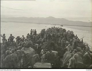 AT SEA NEAR AITAPE, NORTH EAST NEW GUINEA. 1944-04-21. UNMOLESTED BY JAPANESE ATTACK THE CONVOY WHICH WAS TO LAND RAAF PERSONNEL AT KORAKO VILLAGE MOVES TO ITS OBJECTIVE WITH DECK AND BETWEEN DECKS ..