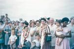 A group of Teal Solent crew wearing garlands in Fiji pictured with a local family