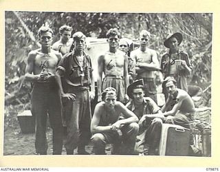 WAITAVALO AREA, WIDE BAY, NEW BRITAIN. 1945-03-16. FRONT LINE STRETCHER BEARERS OF THE 6TH FIELD AMBULANCE, ARMY MEDICAL CORPS, AND AN AMBULANCE JEEP AT THE BEACHHEAD