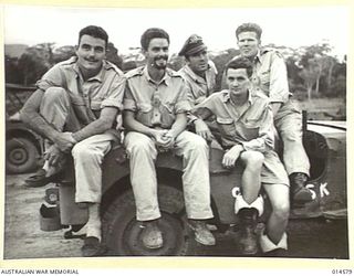 1943-04-05. NEW GUINEA. IN A MOONLIGHT ATTACK ON LAE HARBOUR A FORMATION OF AMERICAN MITCHELL BOMBERS SCORED DIRECT HITS ON AN ENEMY SUBMARINE UNLOADING CARGO. HERE ARE SOME OF THE MEN WHO ..