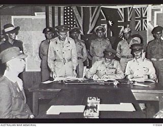 TOROKINA, BOUGAINVILLE. 1945-09-08. LIEUTENANT-GENERAL (LT-GEN) S. G. SAVIGE, GENERAL OFFICER COMMANDING 2 CORPS, ACCEPTED THE SURRENDER OF ALL JAPANESE FORCES ON BOUGAINVILLE FROM LT-GEN M. KANDA, ..