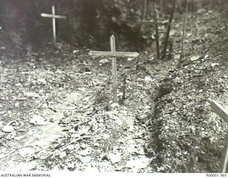 NEW BRITAIN, 1945-09. UNIDENTIFIED GRAVES ON THE GAZELLE PENINSULA. (RNZAF OFFICIAL PHOTOGRAPH.)