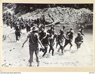TOROKINA, BOUGAINVILLE. 1945-09-22. JAPANESE TROOPS FROM NAURU ISLAND, ON ARRIVAL AT TOROKINA PER SS RIVER BURDEKIN AND SS RIVER GLENELG, WERE MARCHED ALONG THE PIVA ROAD TO THE PRISON COMPOUND AT ..