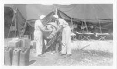 Two nurses at water supply tank