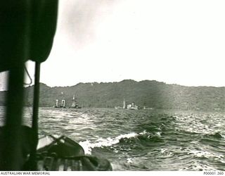 THE SOLOMON ISLANDS, 1945-10-12. TWO SHIPS DAMAGED AND SUNK OFF THE COAST OF BOUGAINVILLE ISLAND DURING WW2. (RNZAF OFFICIAL PHOTOGRAPH.)