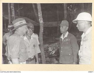 SAMANSO ISLAND, SOLOMON ISLANDS. 1945-11-13. LIEUTENANT COLONEL H.L.E. DUNKLEY, COMMANDING OFFICER, 7 INFANTRY BATTALION (1) TALKING TO LIEUTENANT GENERAL M. KANDA (2) AND VICE-ADMIRAL BARON T. ..