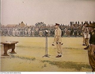 Major General H C H Robertson, GOC 6th Division, addressing the parade at the ceremony at which the commander of the 18th Japanese Army in New Guinea, Lieutenant General Hatazo Adachi, signed the ..