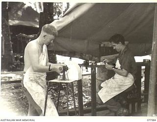 NX169101 CORPORAL A. WILLIAMS (1) AND SX3725 STAFF SERGEANT J.R. BLUNDELL (2), DENTAL MECHANICS OF "A" SECTION, 82ND DENTAL UNIT MAKING ARTIFICIAL DENTURES IN THE UNIT WORKSHOP