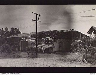 LAE, NEW GUINEA. 1943-10-04. EXTERIOR VIEW OF THE DAMAGE DONE TO THE FREEZING WORKS DURING THE ALLIED PRE-INVASION BOMBING RAIDS. THE WORKS HAVE SINCE BEEN REPAIRED BY VX53334 CAPTAIN S. RICHARDS ..