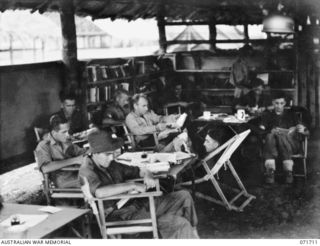 LAE, NEW GUINEA, 1944-03-25. PATIENTS IN THE RED CROSS READING AND WRITING ROOM AT THE 112TH CONVALESCENT DEPOT. IDENTIFIED PERSONNEL ARE: VX75499 PRIVATE E. SUPPLE, 1 ADVANCED REINFORCEMENT DEPOT ..