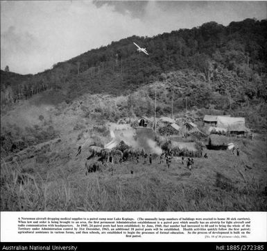 A Norseman aircraft dropping medical supplies to a patrol camp near Lake Kopiago