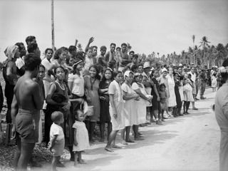 NAURU ISLAND. 1945-09-14. A SECTION OF THE NATIVE AUDIENCE WHO ARE ATTENDING THE FLAG RAISING CEREMONY SOON AFTER TROOPS OF THE 31/51ST INFANTRY BATTALION TOOK OVER THE AREA