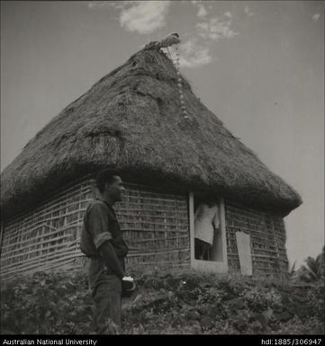 Man in the doorway of a house