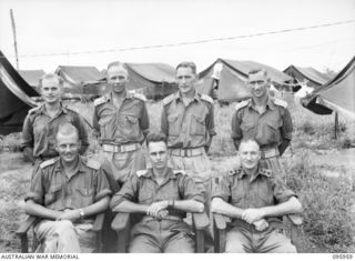 CAPE WOM, WEWAK AREA, NEW GUINEA. 1945-08-31. LIEUTENANT COLONEL J.C. HAY, COMMANDING OFFICER HEADQUARTERS ROYAL AUSTRALIAN ENGINEERS 6 DIVISION (2), WITH HIS HEADQUARTERS STAFF OFFICERS