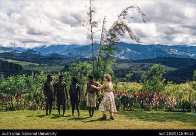 Okapa - Okapa Post - groups of Natives and Helen