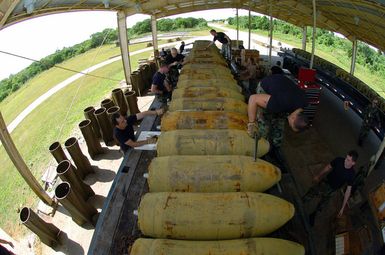 At Andersen Air Force Base (AFB), Guam (GU), Munitions experts from the US Air Force (USAF) 5th Bomb Wing (BW), based at Minot Air Force Base (AFB), North Dakota (ND), assemble M-117 750-pound bombs