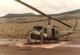 Marian Kuzma (WG #467) by a Huey U.S. Army helicopter