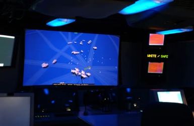 On board the US Navy (USN) Amphibious Command Ship USS BLUE RIDGE (LCC 19), aircraft and ships are tracked on screen utilizing the Area Air Defense Coordinator (AADC). The BLUE RIDGE is here to participate in Exercise TANDEM THRUST 2003