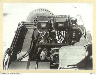 BOUGAINVILLE ISLAND. 1945-02-22. A SLAVE CHARGER FITTED INTO A JEEP OF B SQUADRON WORKSHOP, 2/4TH ARMOURED REGIMENT. THE DESIGN AND FITTING OF THESE UNITS WAS DONE BY THE UNIT WORKSHOP PERSONNEL