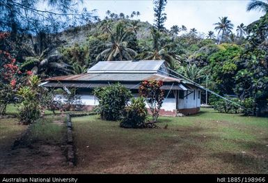 Cook Islands - White building with rusted corrugated roof