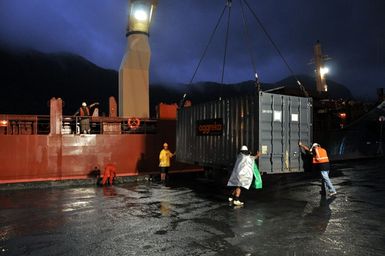 Earthquake ^ Flooding ^ Tsunami - Pago Pago, American Samoa, November 14, 2009 -- A complete power generating plant packaged as a set of 54 shipping containers arrived in American Samoa aboard a chartered ship from Singapore. Most were installed the next day at the Satala power plant that was destroyed by the tsunami on September 29, 2009. When linked together, the generators will replace all the 14. 7 megawatts lost at the Satala plant. The rest of the equipment was installed at the island's remaining power plant in Tafuna, where they will relieve the load on that facility. Richard O'Reilly/FEMA.