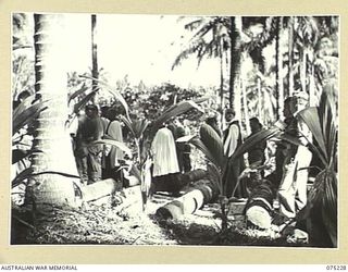 NORTH ALEXISHAFEN, NEW GUINEA. 1944-08-10. THE CONFIRMING BISHOP, VX20306 THE RIGHT REVEREND C.L. RILEY, CBE, VD, BISHOP OF BENDIGO, VICTORIA, HEADQUARTERS, NEW GUINEA FORCE, AND HIS ASSISTING ..